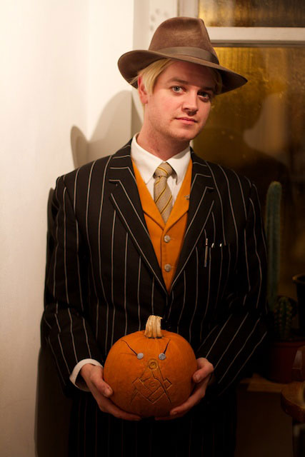 Jeweler Pete Modelling his Moustache on a Pumpkin